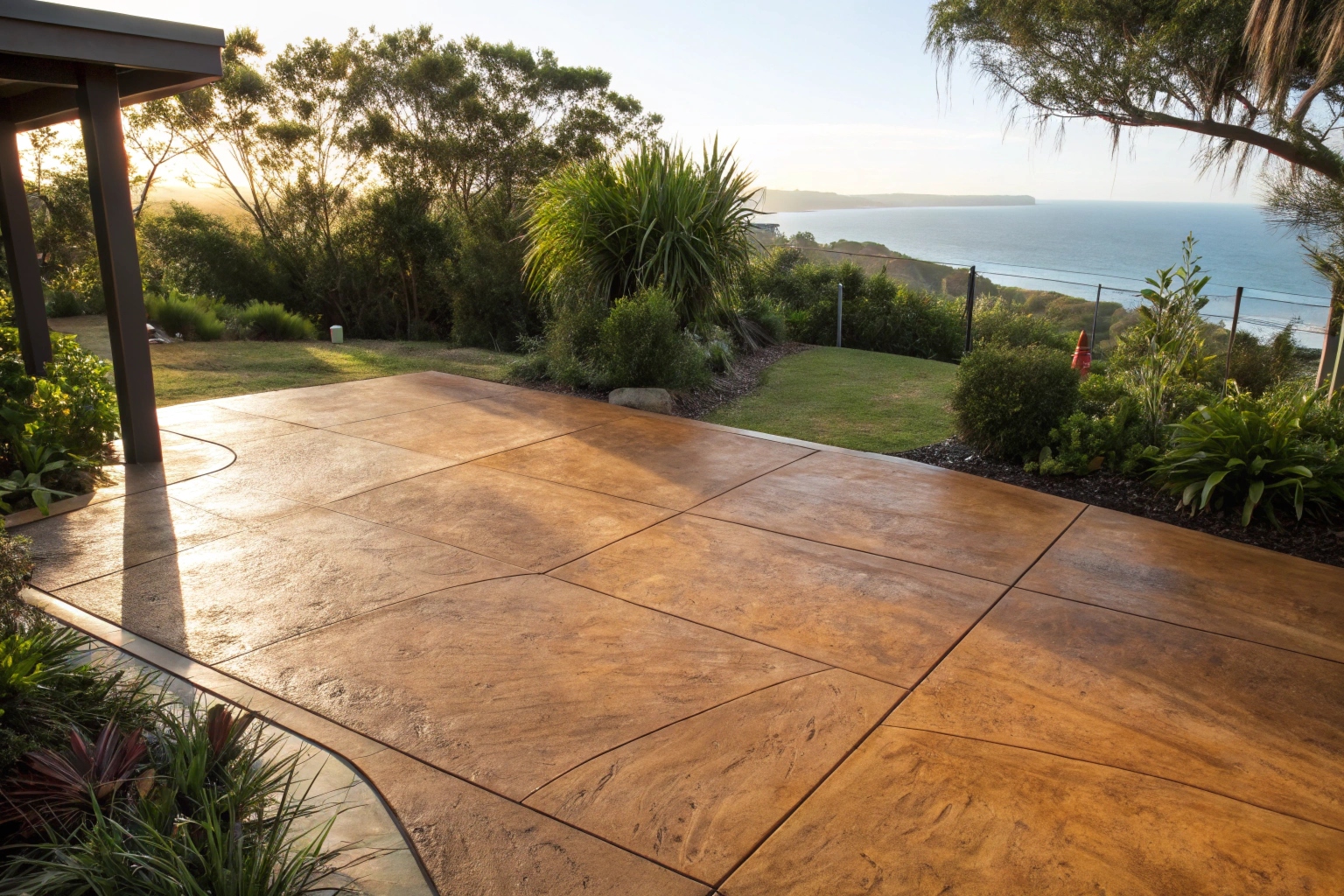 Close up of coloured broom finish concrete patio slab surface in coastal NSW backyard